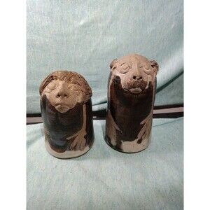 Clay salt and pepper shakers, man/woman figures